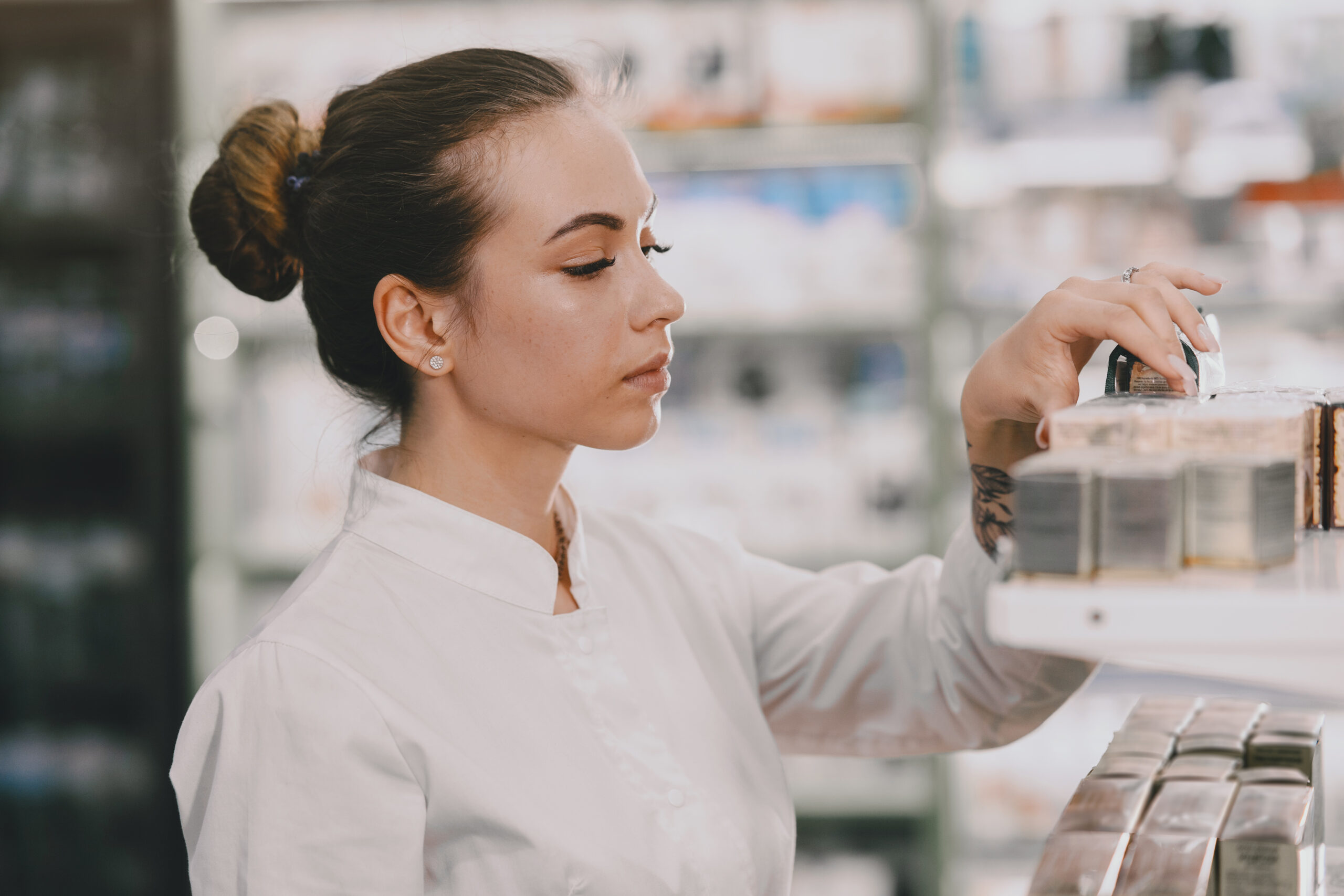 Woman pharmacist checking medicine in pharmacy